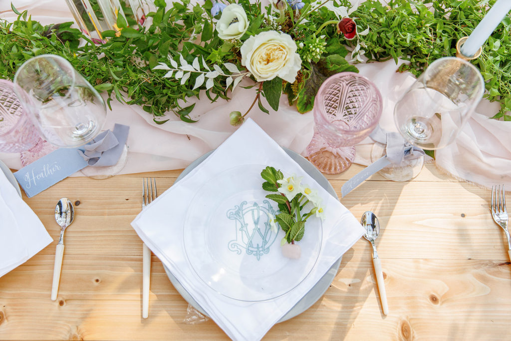 wedding tablescape with florals and glassware