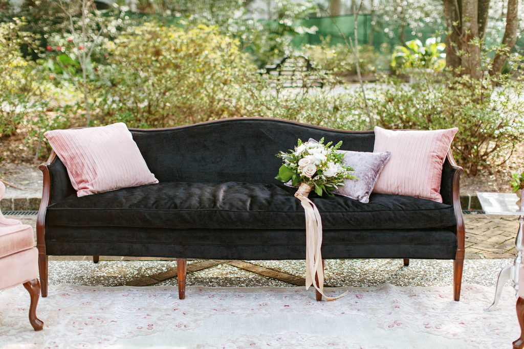 luxury wedding bouquet and lounge with velvet couch