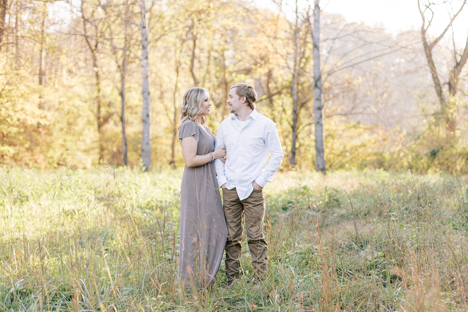 Classic joyful Virginia couple pose for engagement session in romantic outdoor location